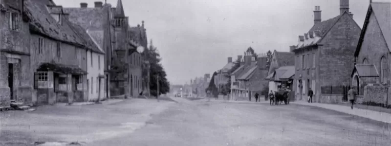 The High Street in the village of Broadway, 1916, with only pedestrians and horse traffic visible. Within a decade it was part of both A44 and A46. Click to enlarge